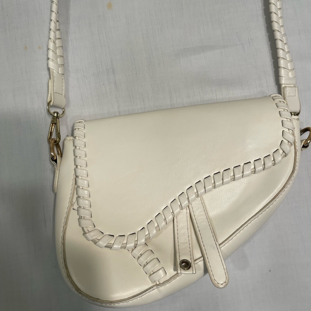 Elegant Cream Saddle Bag with whipstitch trim off white leather crossbody bag